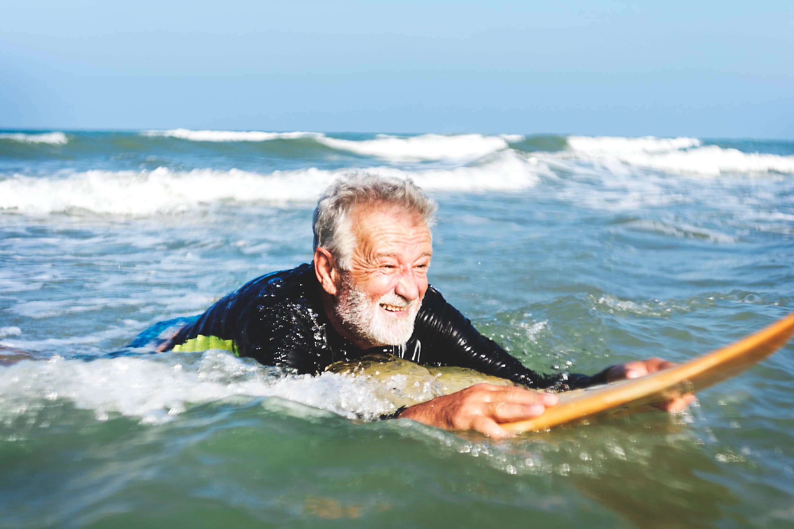 Older man surfing